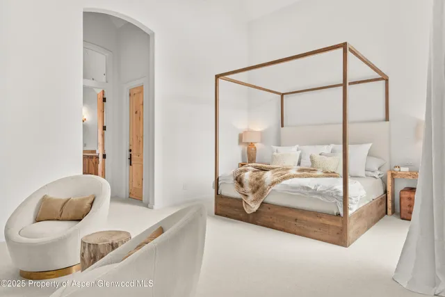 a spacious bathroom with a granite countertop sink a mirror a shower and bathtub