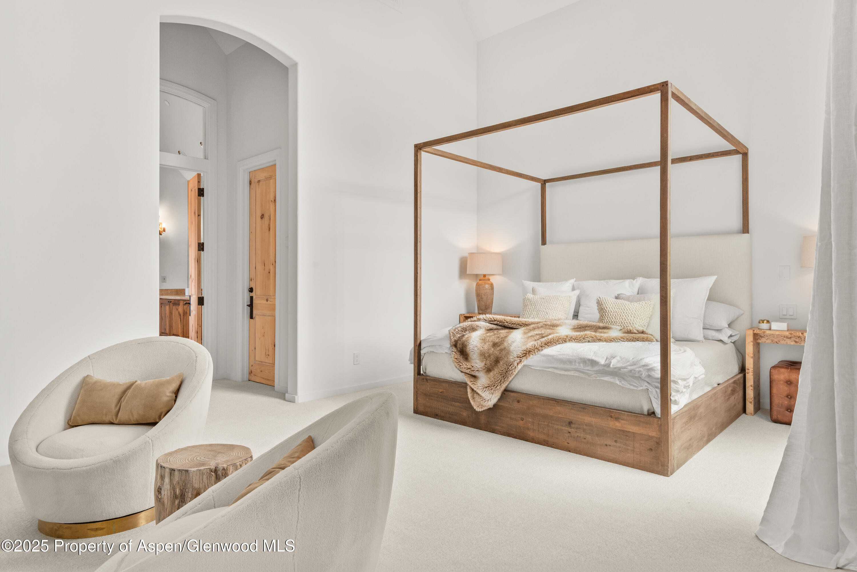 1495 Homestake Drive, Unit 2 Aspen, CO 81611 - Photo 26 of 42 a bedroom with a bed and glass walk in closet