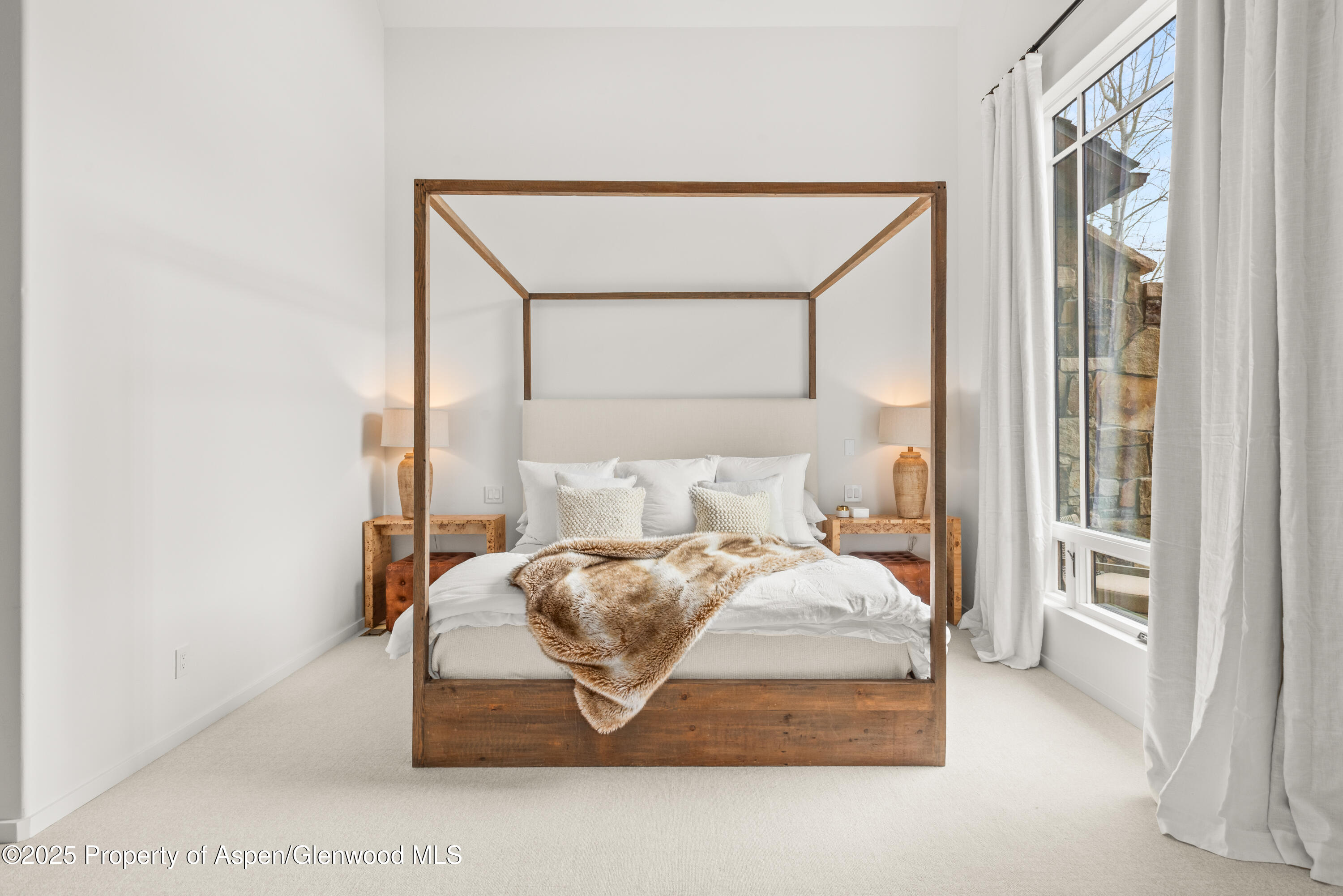 1495 Homestake Drive, Unit 2 Aspen, CO 81611 - Photo 27 of 42 a bedroom with a bed and a window