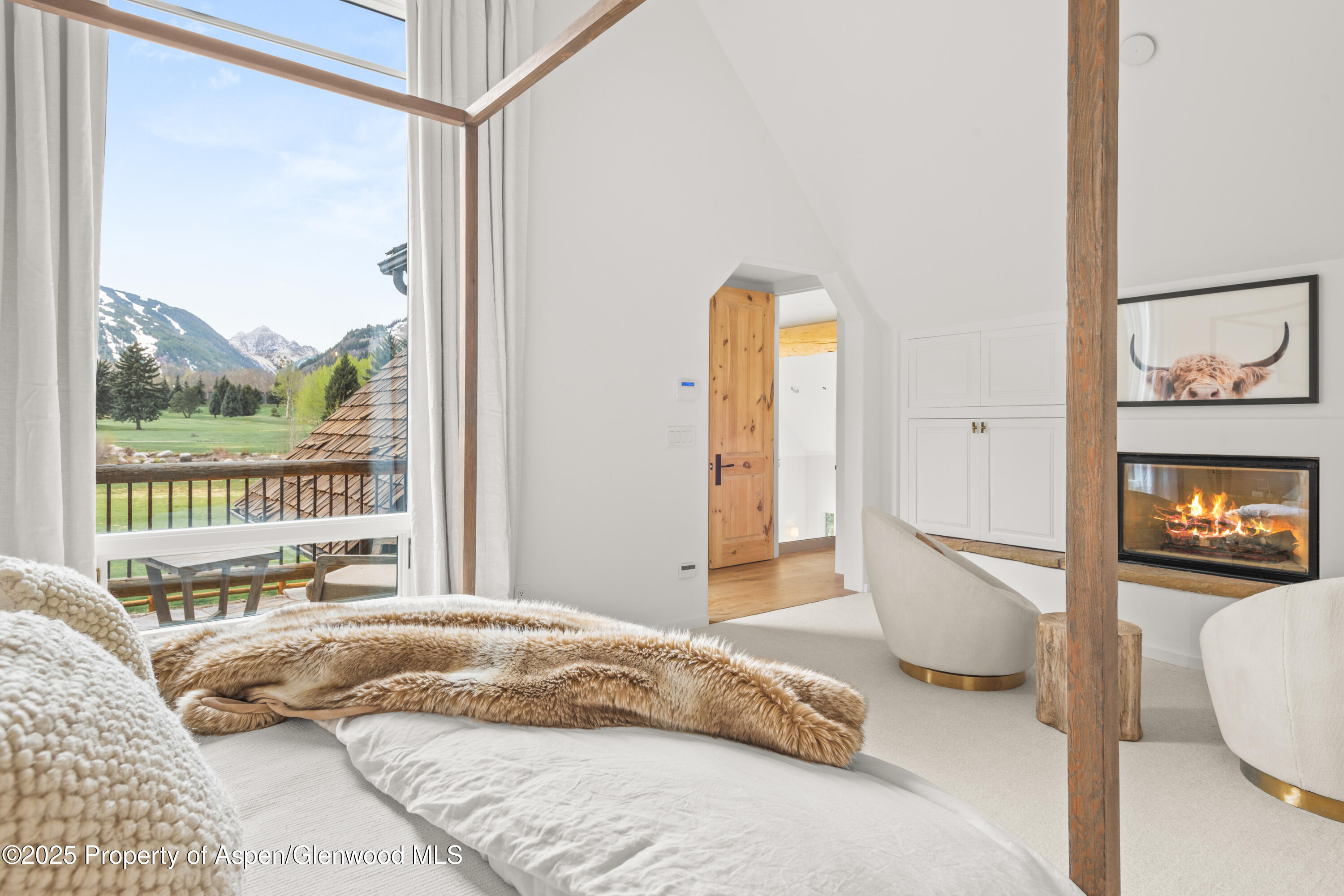 1495 Homestake Drive, Unit 2 Aspen, CO 81611 - Photo 28 of 42 a bedroom with a bed and a large window with outer view