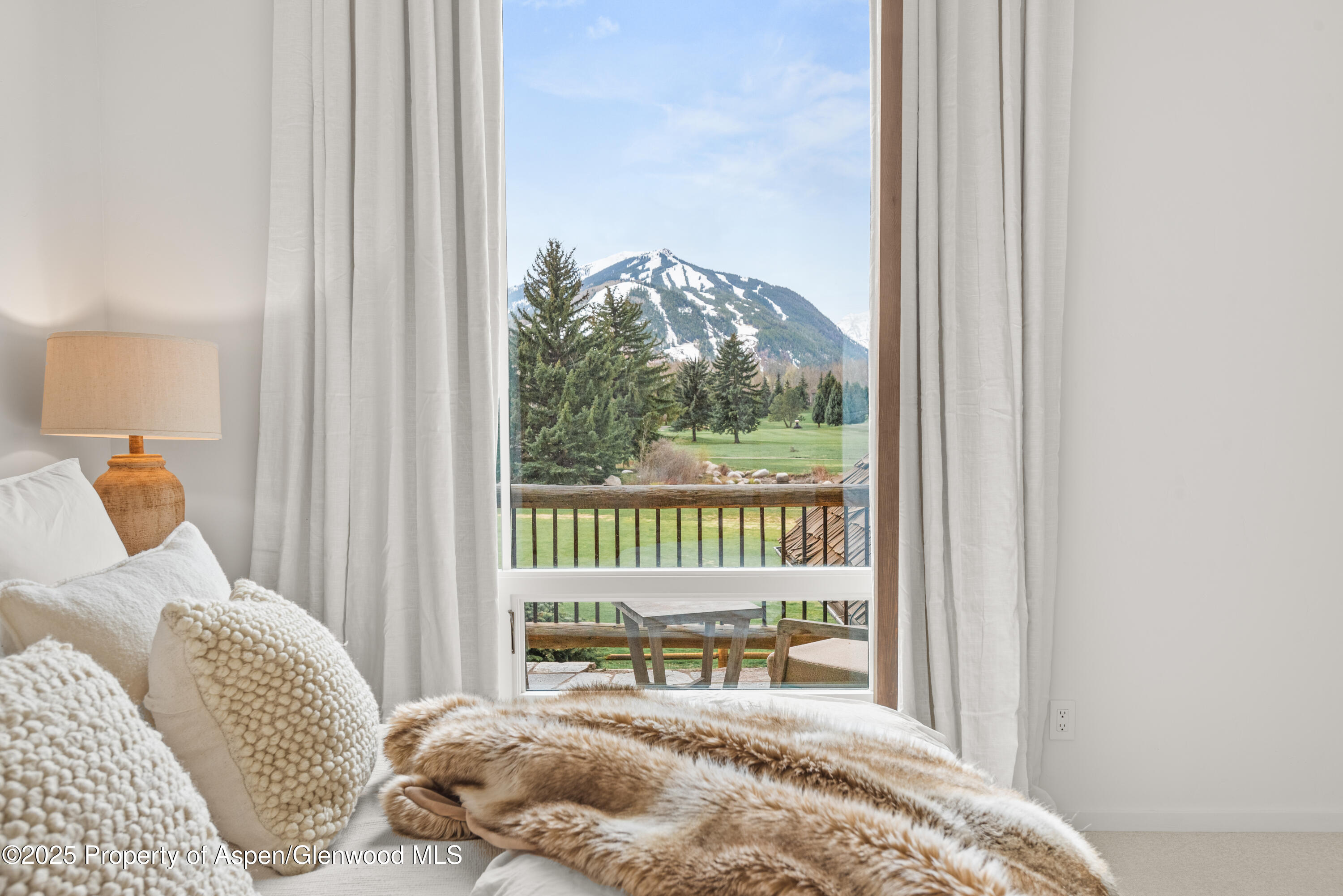 1495 Homestake Drive, Unit 2 Aspen, CO 81611 - Photo 29 of 42 a bedroom with a bed and a window