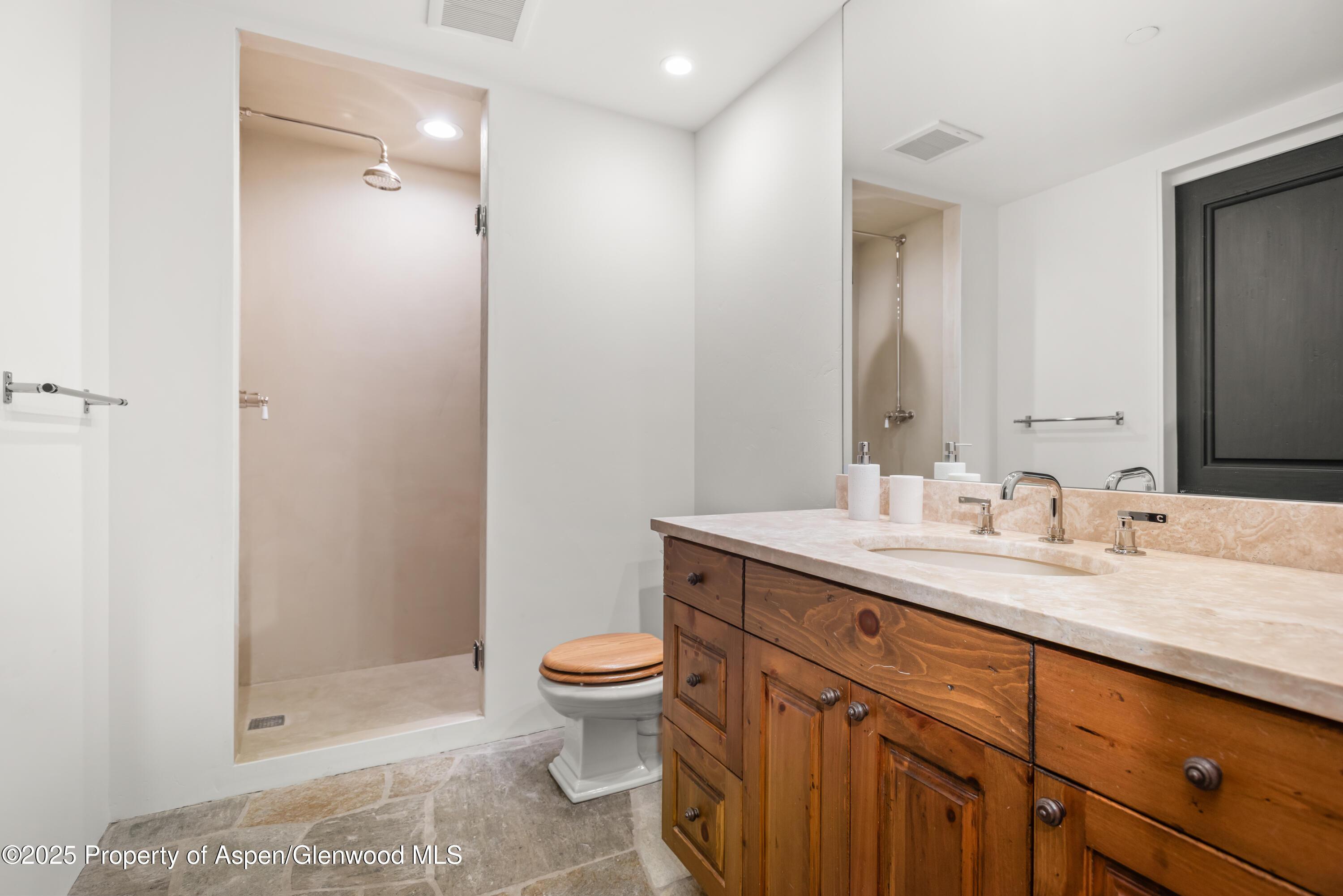 1495 Homestake Drive, Unit 2 Aspen, CO 81611 - Photo 37 of 42 a bathroom with a granite countertop sink toilet and shower