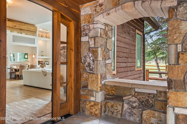 a living room with fireplace furniture and a flat screen tv