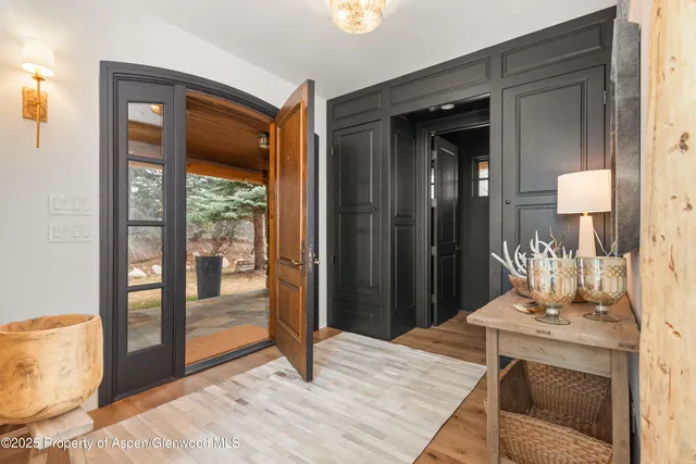 a living room with fireplace furniture and a flat screen tv