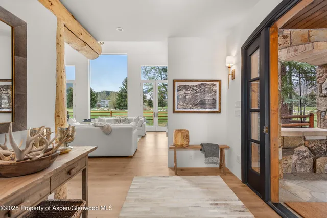 a living room with furniture or outdoor view and a large window