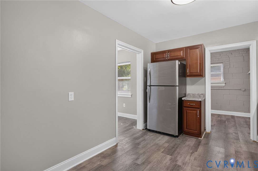 1118 Andros Road Richmond, VA 23225 - Photo 9 of 28 light gray walls, stainless steel refrigerator, an