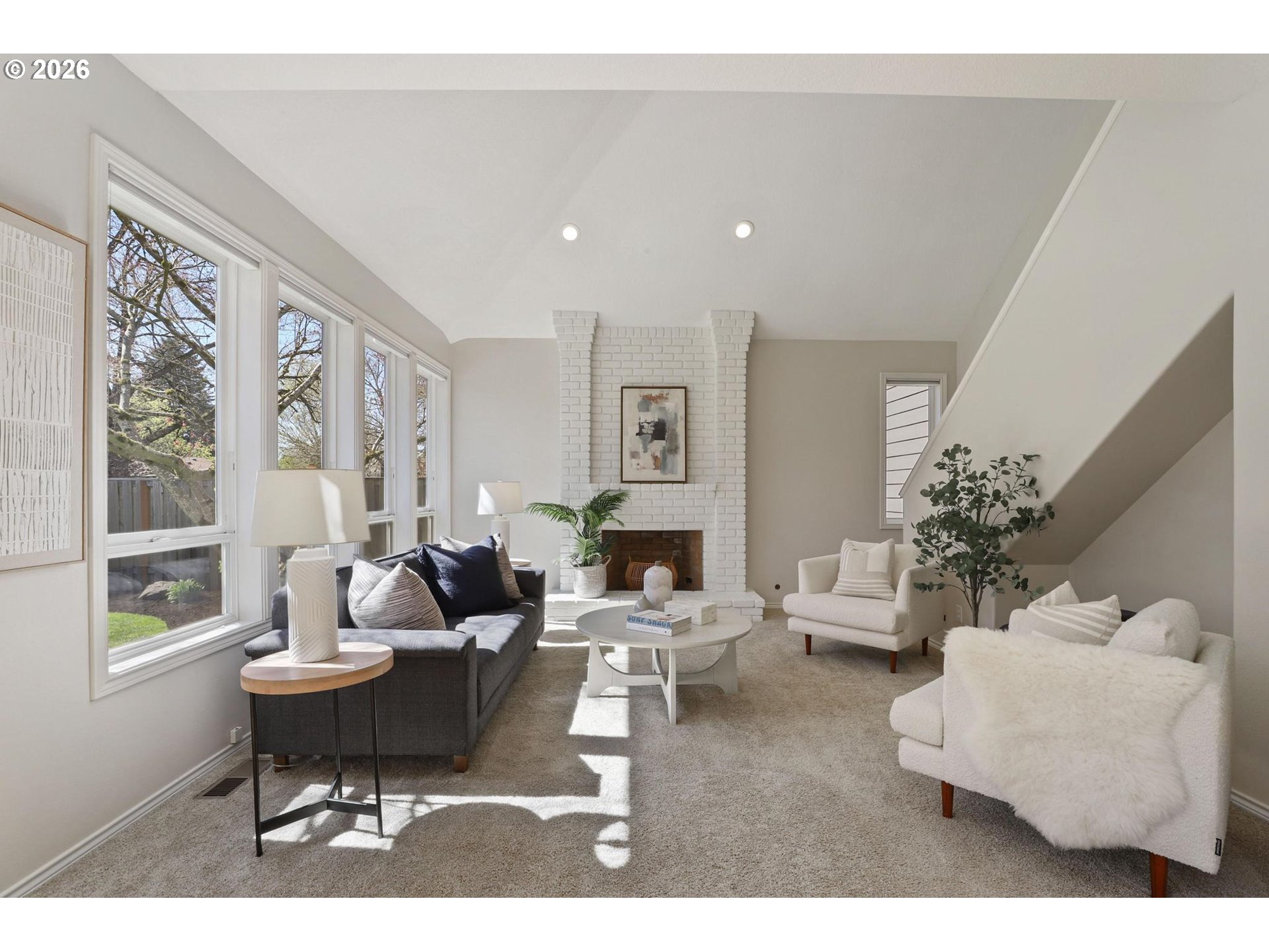 17650 Northwest Gilbert Lane Portland, OR 97229 - Photo 11 of 26 a living room with furniture and a large window