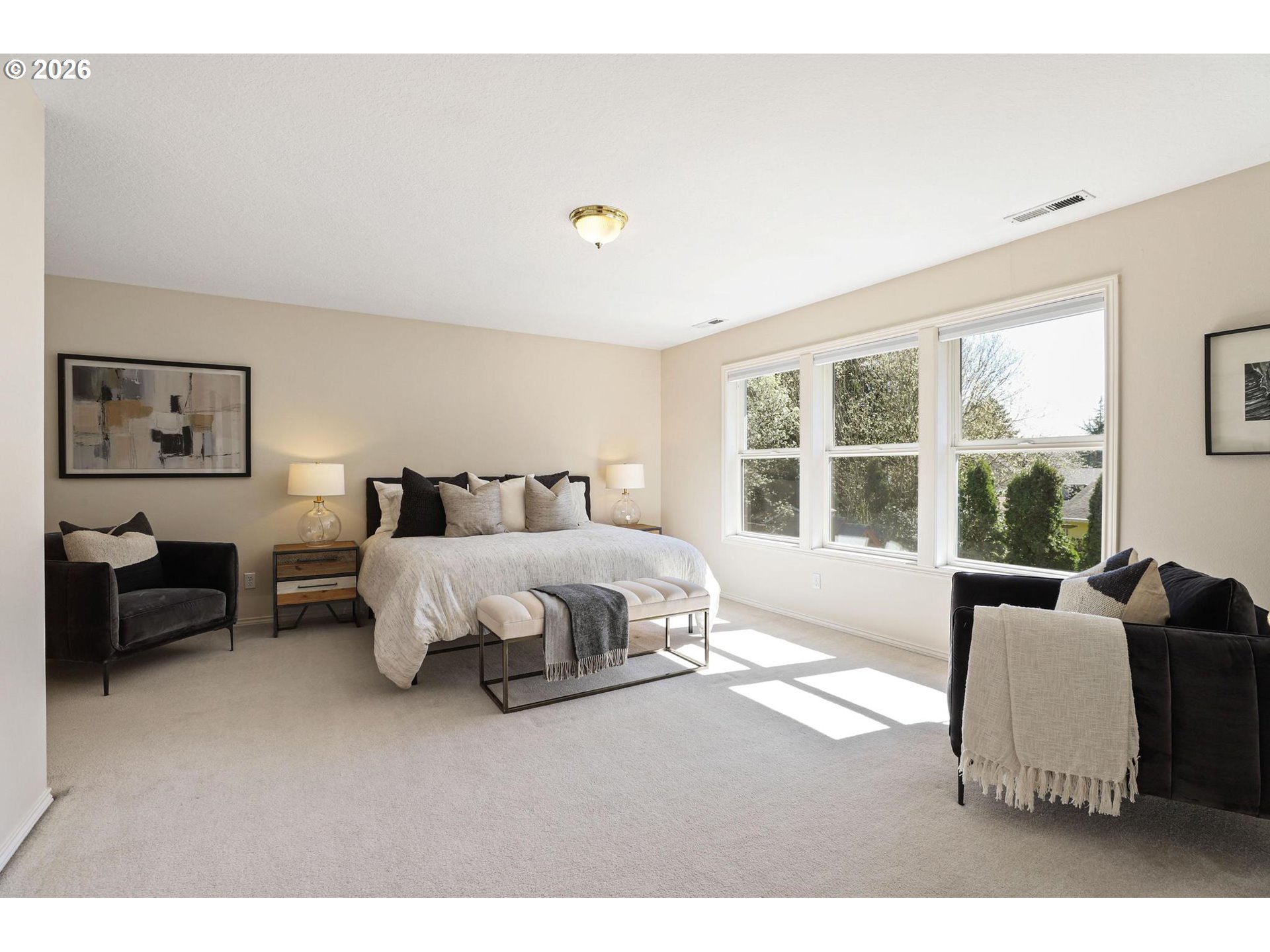 17650 Northwest Gilbert Lane Portland, OR 97229 - Photo 15 of 26 a spacious bedroom with a bed and glass window