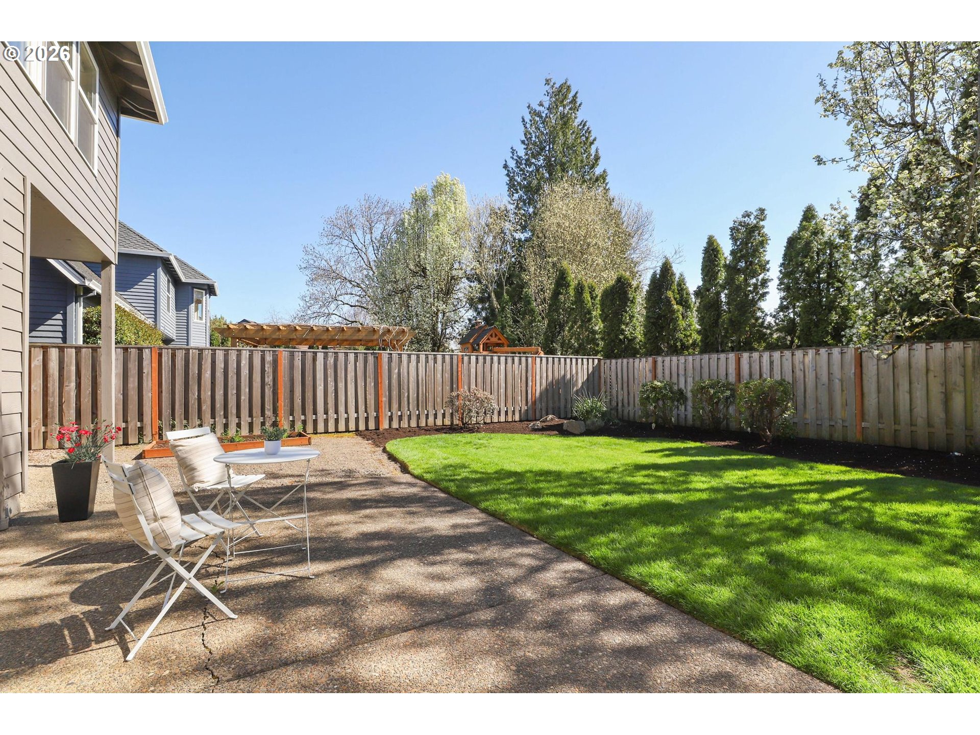 17650 Northwest Gilbert Lane Portland, OR 97229 - Photo 21 of 26 a view of a backyard with wooden fence