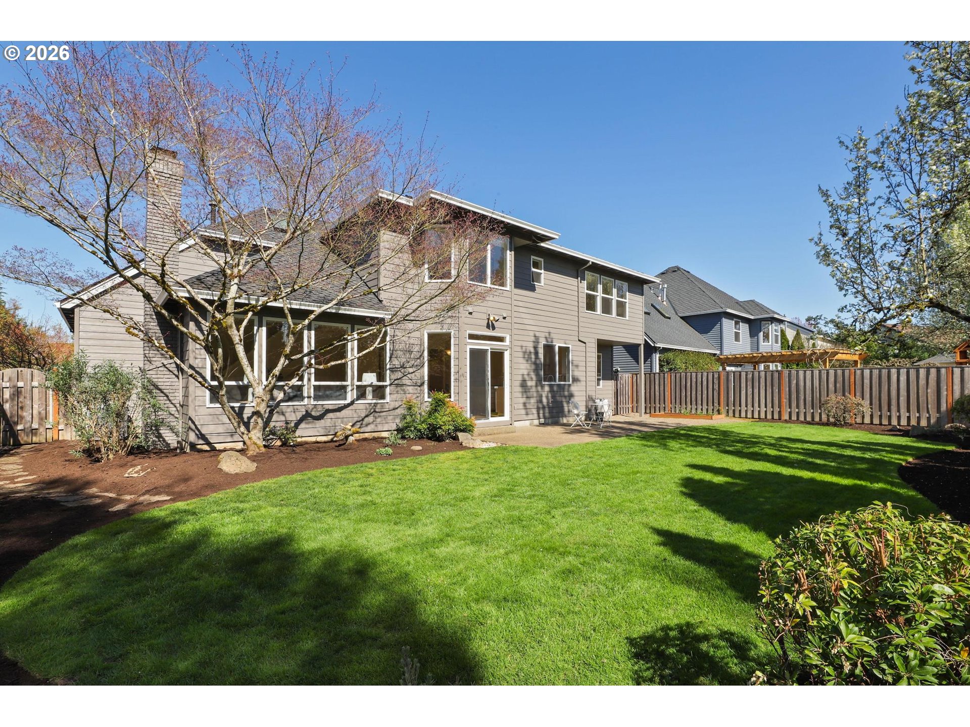 17650 Northwest Gilbert Lane Portland, OR 97229 - Photo 23 of 26 a view of a house with backyard and sitting area