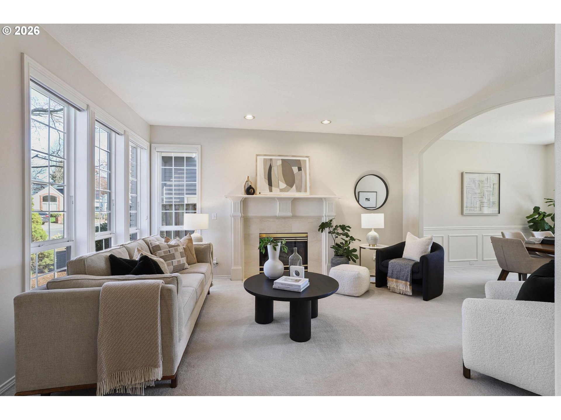 17650 Northwest Gilbert Lane Portland, OR 97229 - Photo 3 of 26 a living room with furniture a fireplace and large windows