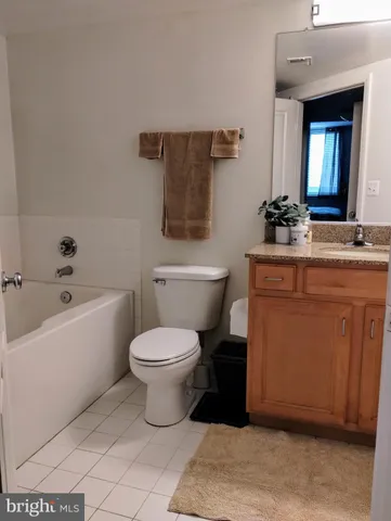 a bathroom with a toilet a sink and bathtub
