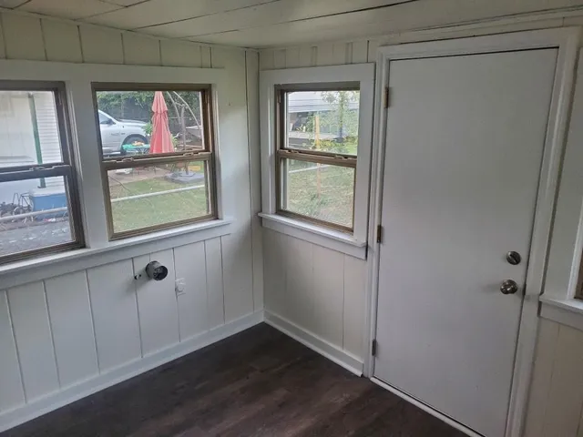 a view of front door with wooden floor