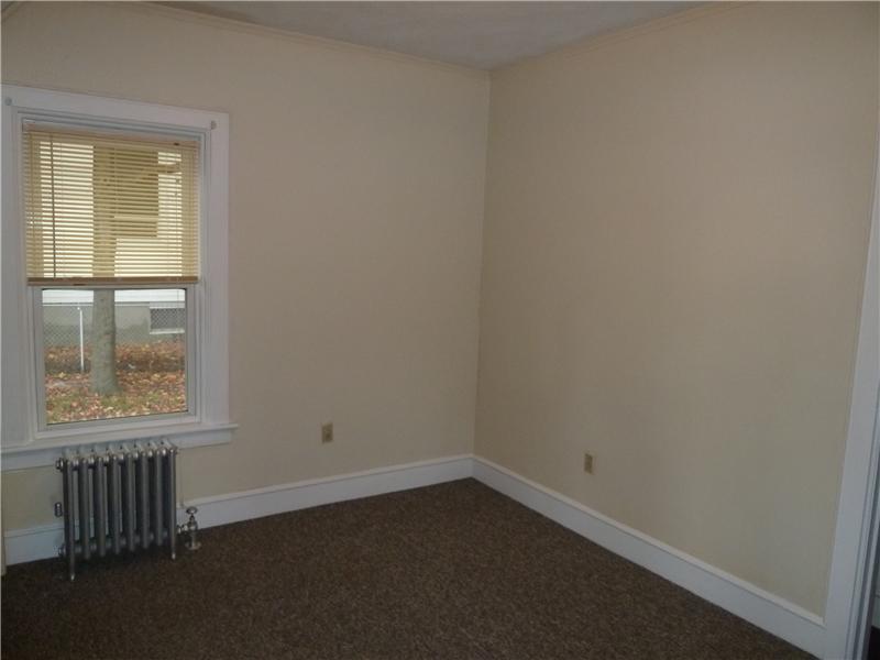 27 Kilvert Street Warwick, RI 02886 - Photo 7 of 18 Exterior Front. First floor bedroom. One of three, all similar in size. High ceilings.