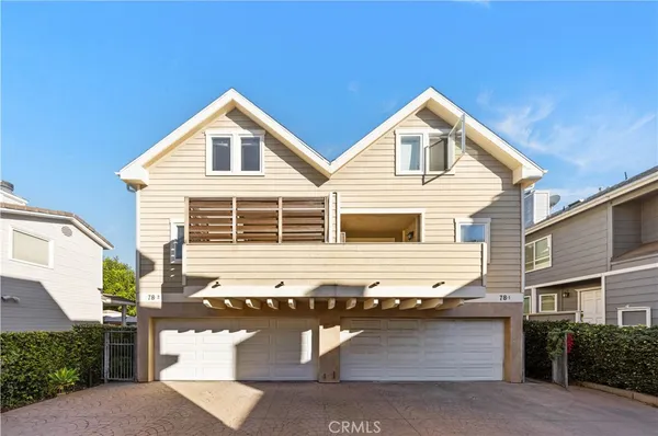 a front view of a house with garage