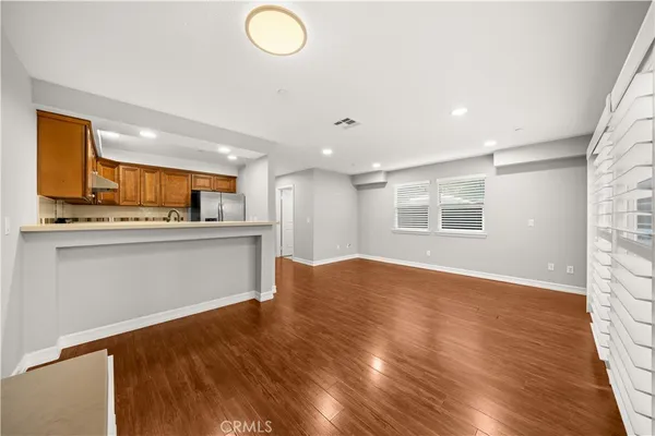 a view of a kitchen with a sink and a window