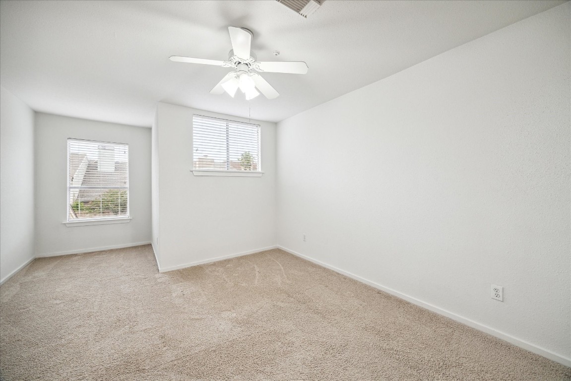 1864 South Gessner Road Houston, TX 77063 - Photo 15 of 17 an empty room with windows and fan
