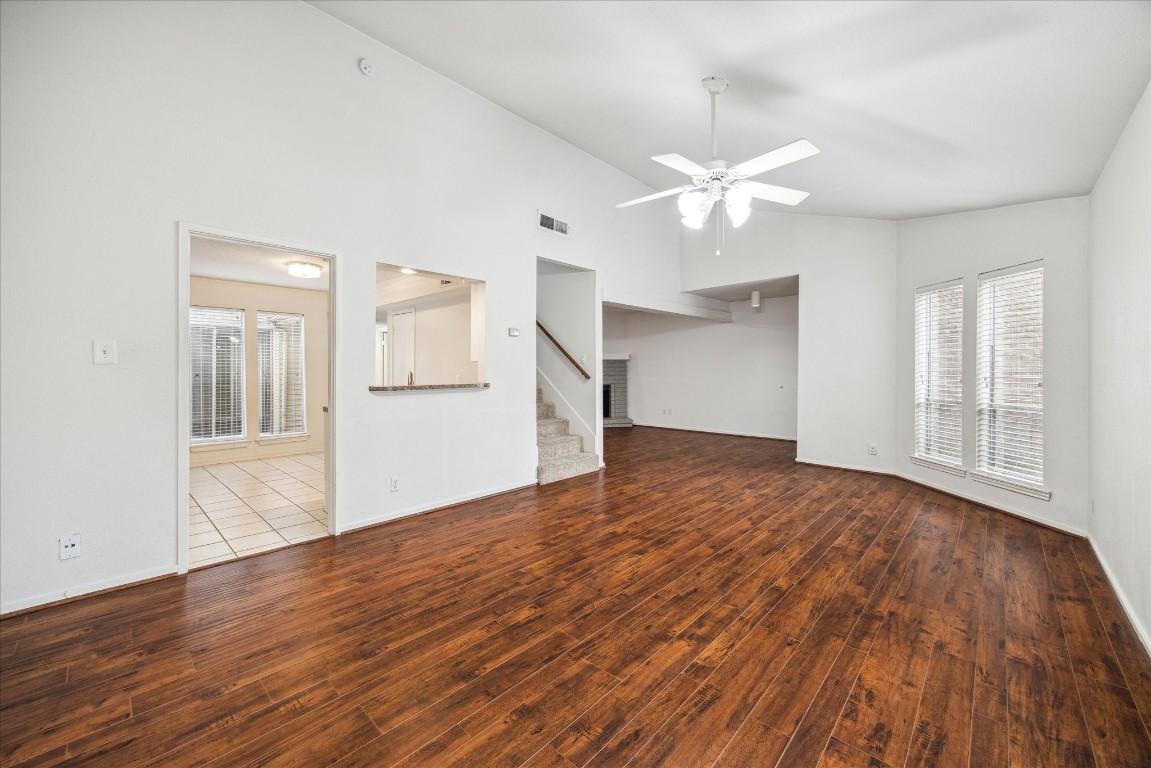1864 South Gessner Road Houston, TX 77063 - Photo 3 of 17 wooden floor in an empty room with a window