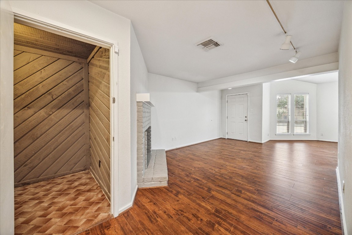 1864 South Gessner Road Houston, TX 77063 - Photo 10 of 17 a view of a room with wooden floor and a window