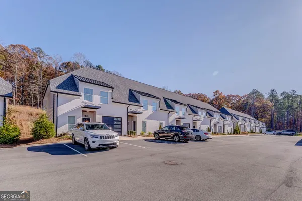 a kitchen with a stove a sink and a microwave