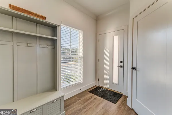 a view of a dining room with furniture and wooden floor