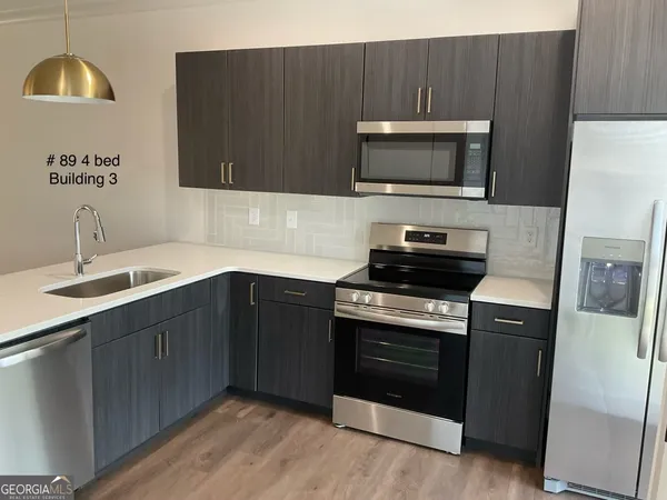 a living room with furniture and a lamp