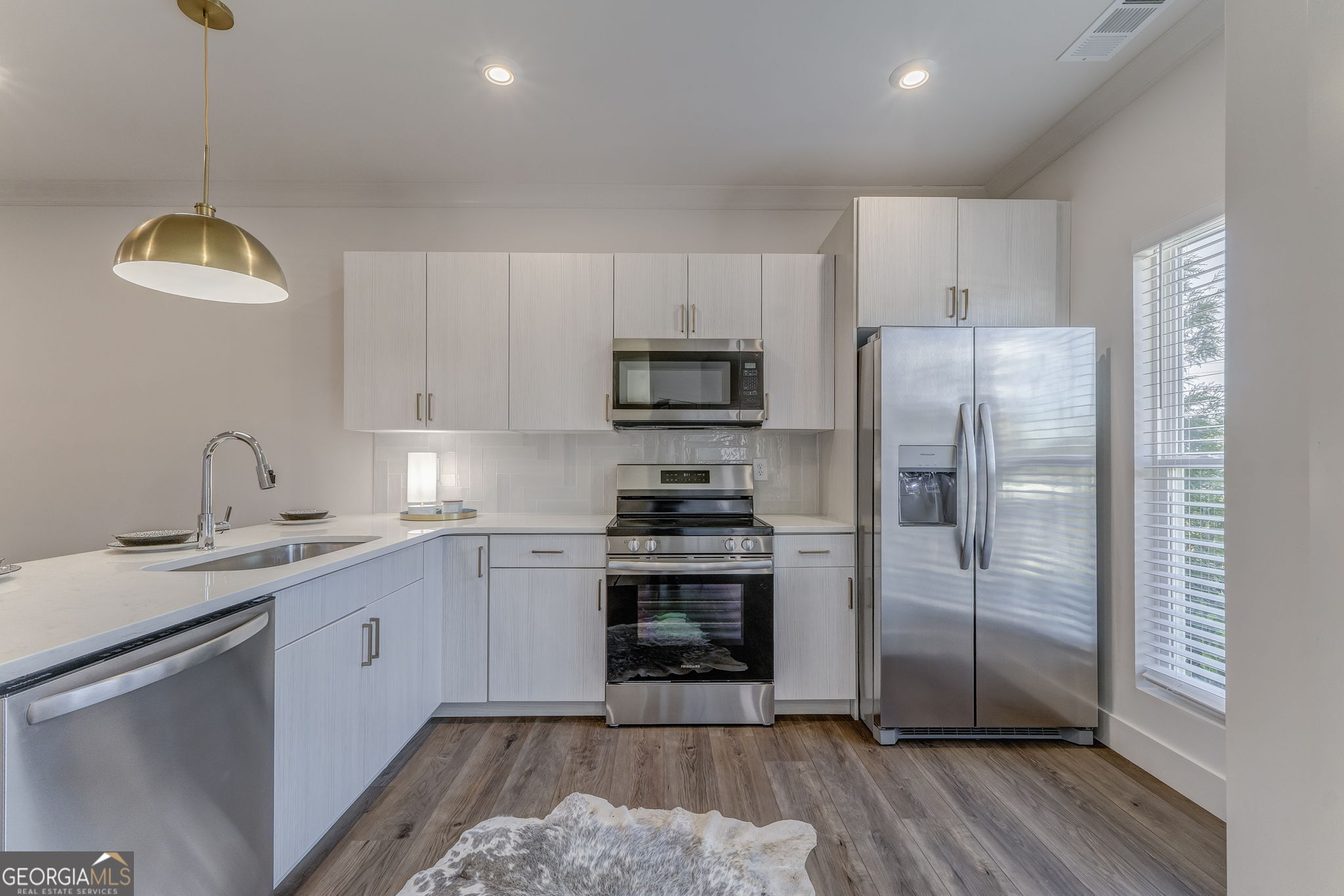 93 Chateau Drive Southeast Rome, GA 30161 - Photo 24 of 66 a kitchen with a sink stainless steel appliances and cabinets
