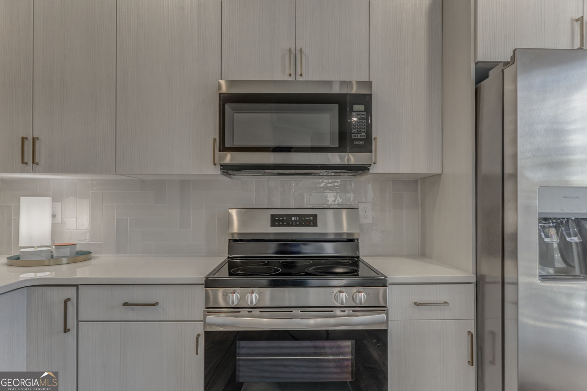 93 Chateau Drive Southeast Rome, GA 30161 - Photo 26 of 66 a kitchen with a stove and a microwave