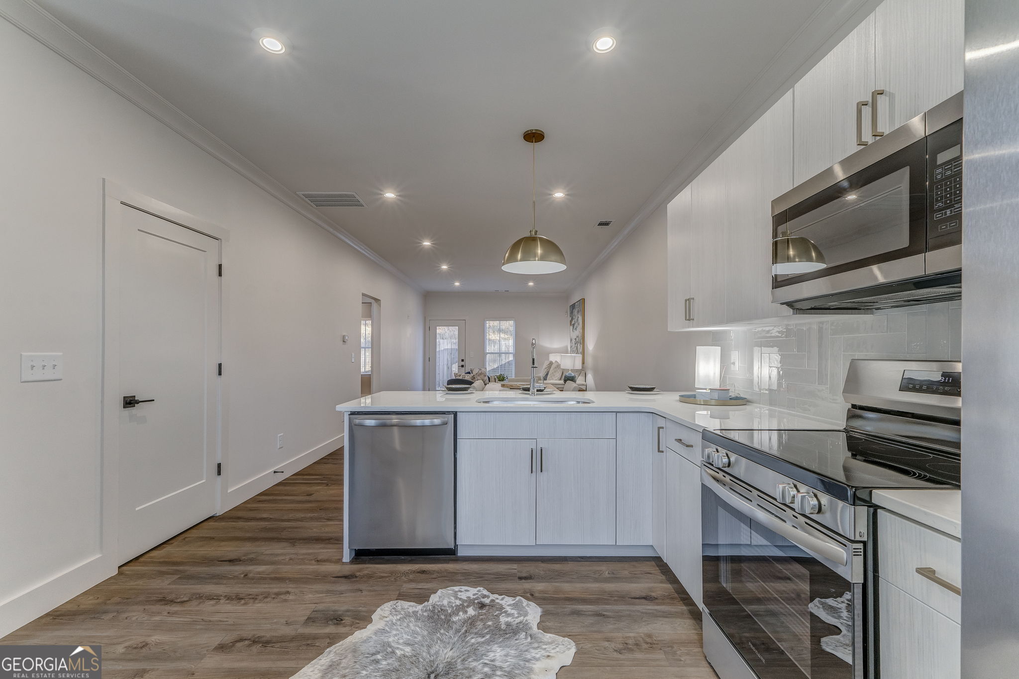 93 Chateau Drive Southeast Rome, GA 30161 - Photo 27 of 66 a kitchen with stainless steel appliances granite countertop a sink and a stove