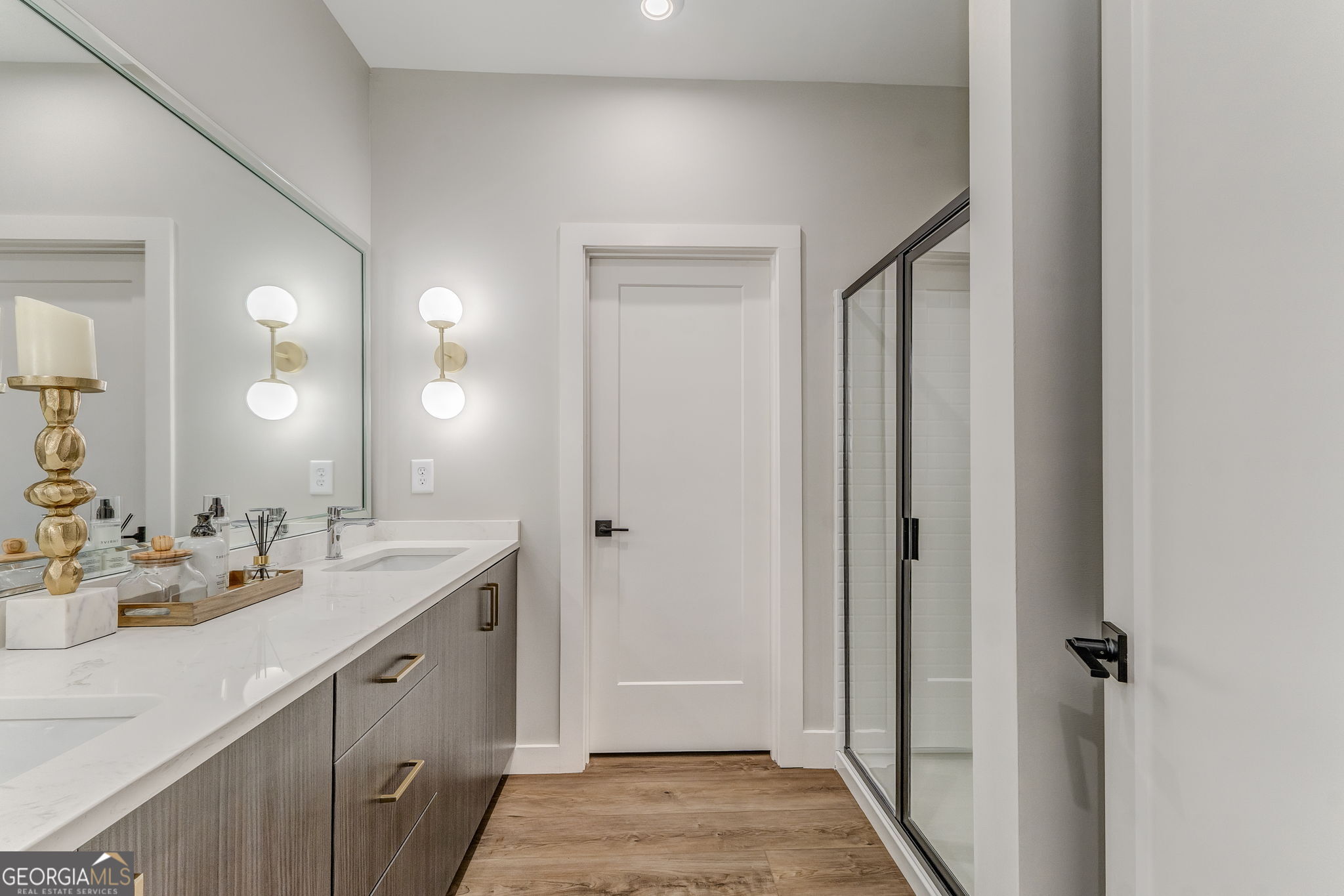93 Chateau Drive Southeast Rome, GA 30161 - Photo 46 of 66 a en suite bathroom with a double vanity sink and a mirror