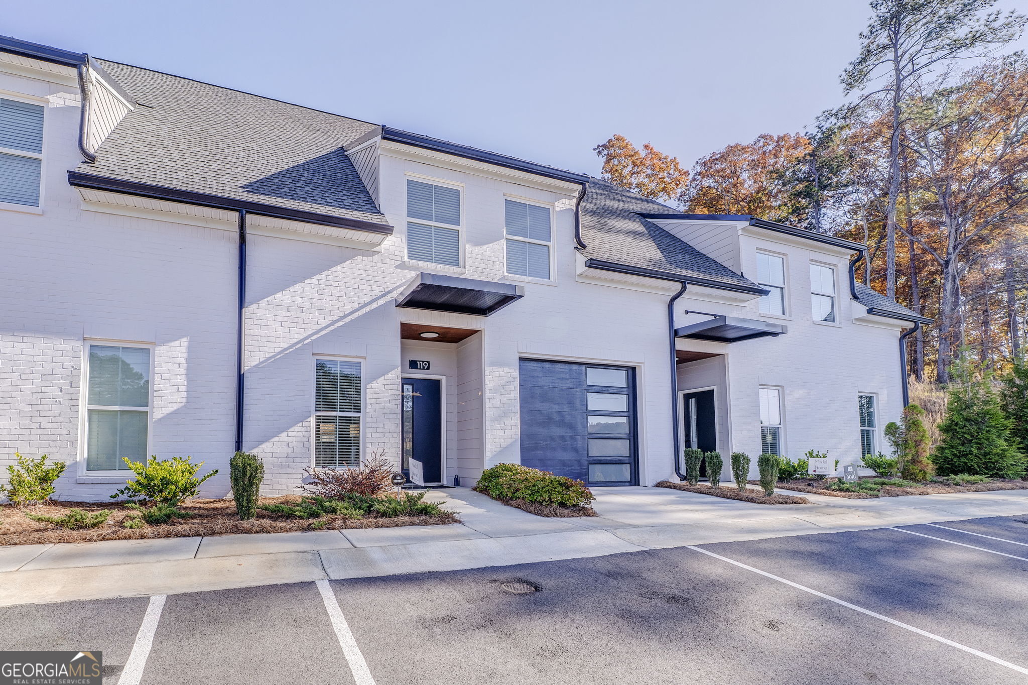 93 Chateau Drive Southeast Rome, GA 30161 - Photo 5 of 66 a front view of a house with garage and plants