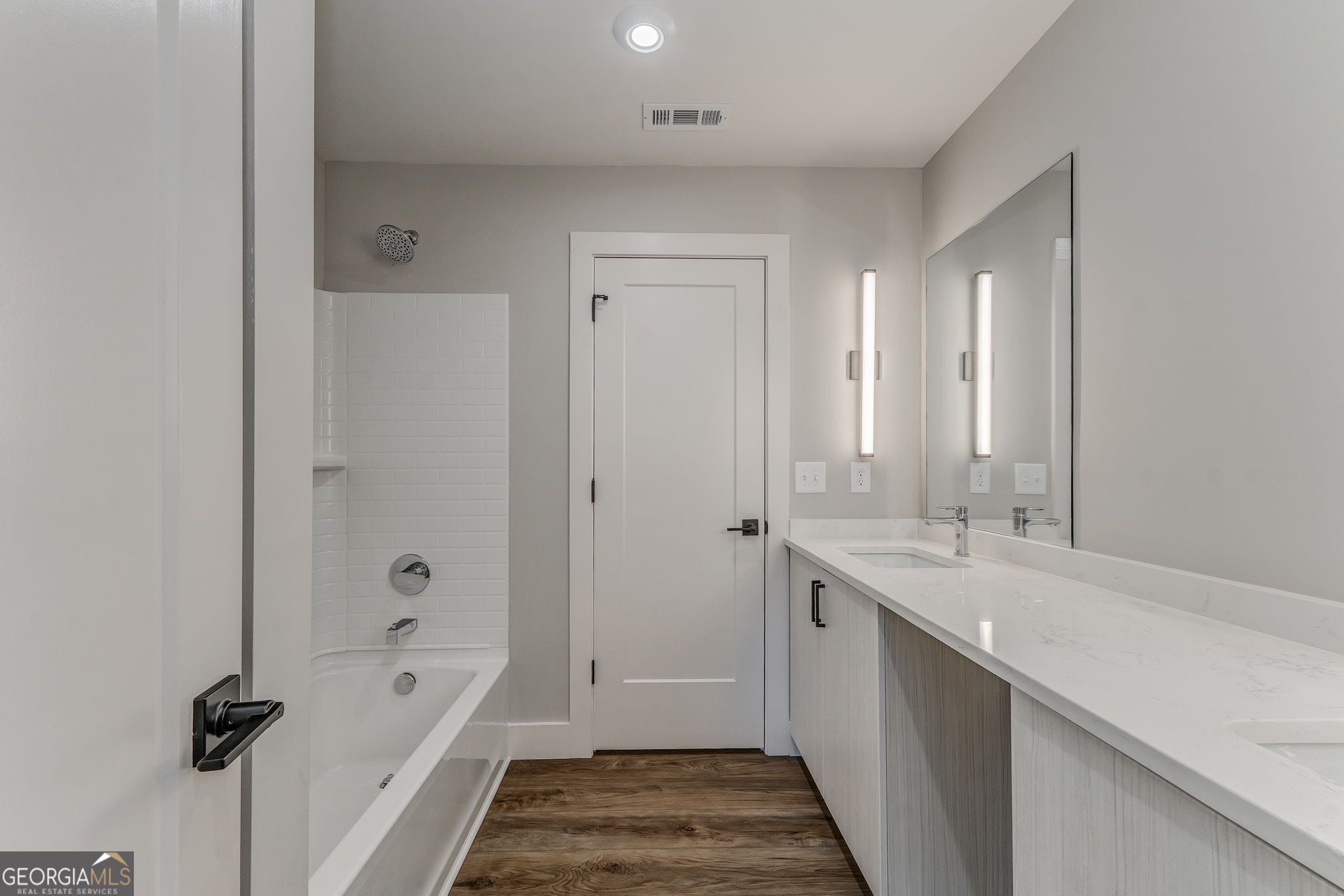 93 Chateau Drive Southeast Rome, GA 30161 - Photo 55 of 66 a bathroom with a tub sink and mirror