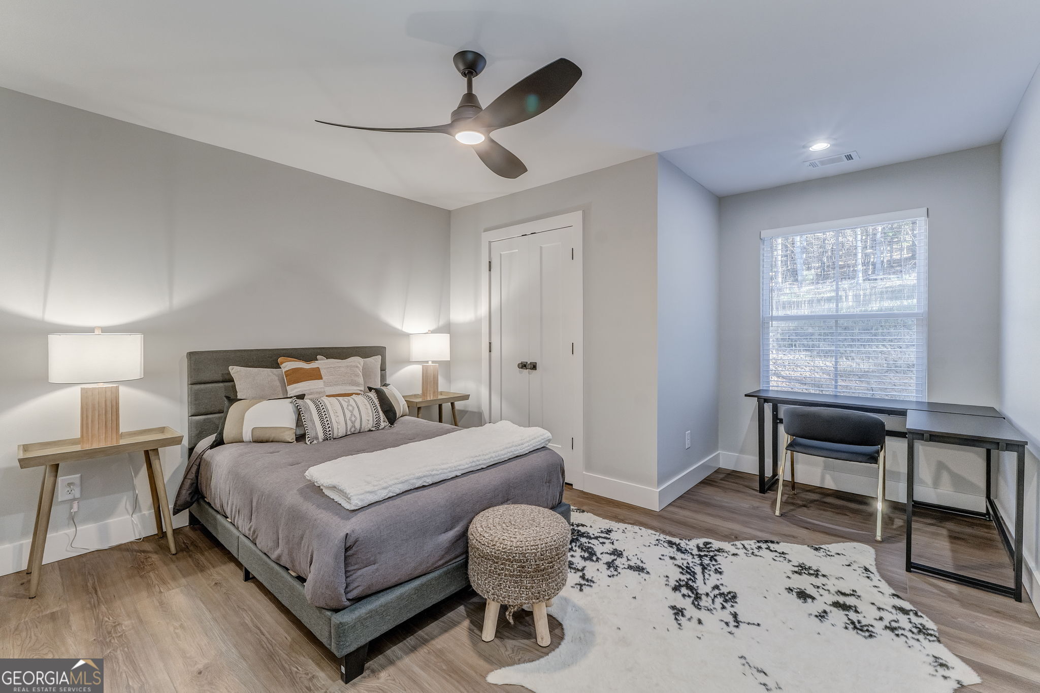 93 Chateau Drive Southeast Rome, GA 30161 - Photo 56 of 66 a bedroom with a bed and a table in it