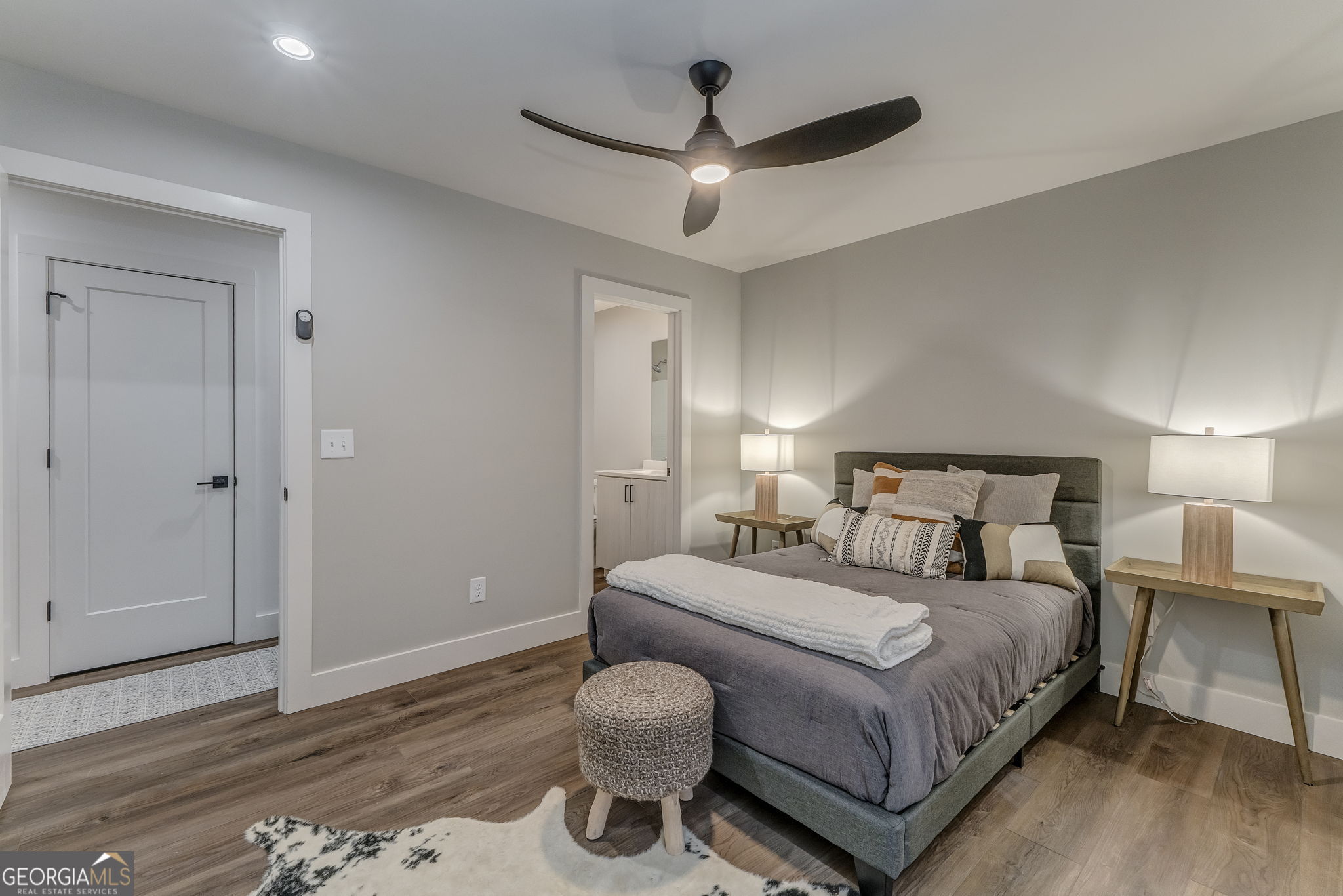 93 Chateau Drive Southeast Rome, GA 30161 - Photo 57 of 66 a bedroom with a bed and wooden floor