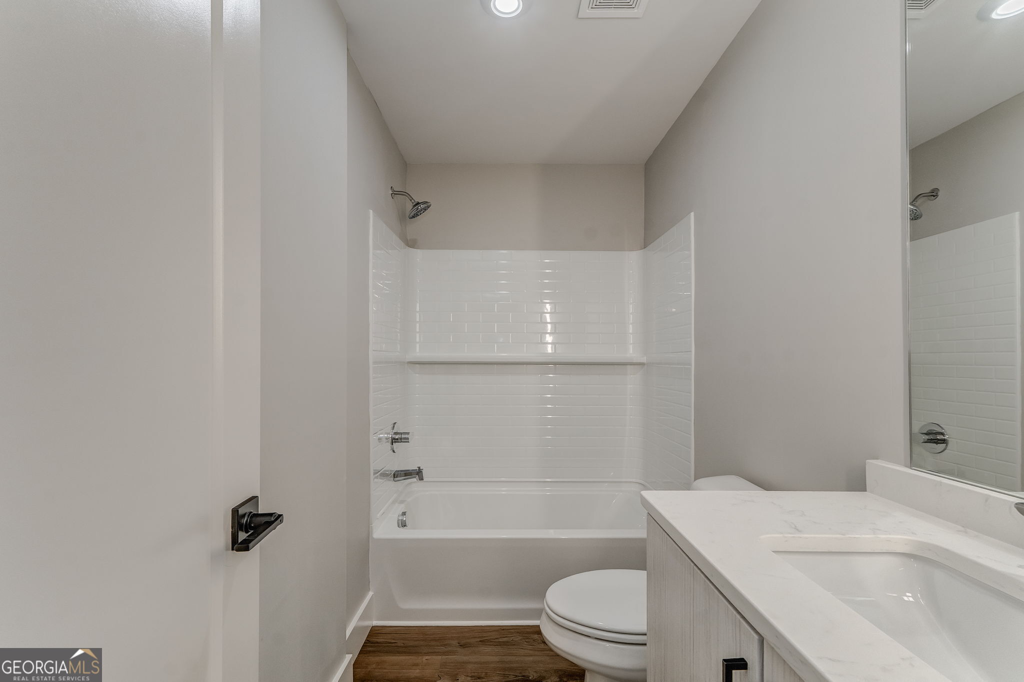 93 Chateau Drive Southeast Rome, GA 30161 - Photo 60 of 66 a bathroom with a granite countertop bathtub shower sink vanity mirror and toilet