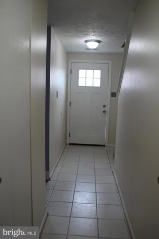 a view of an empty room with windows