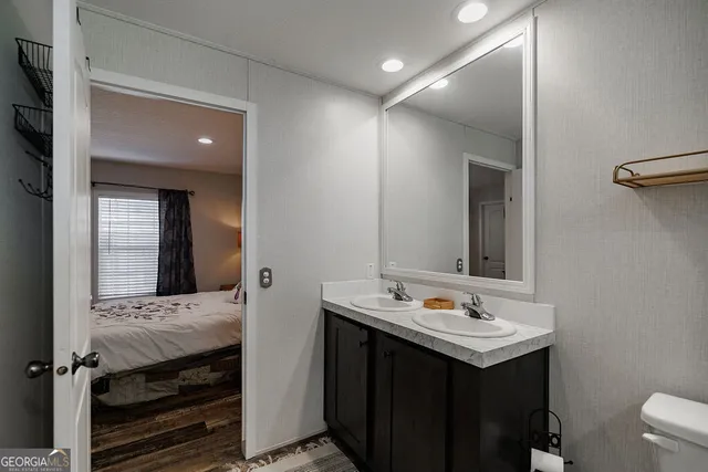 a bathroom with a sink and a mirror