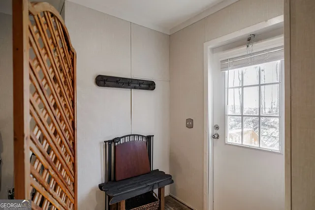 a view of an entryway with wooden floor