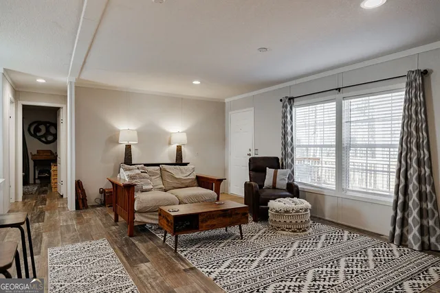 a living room with furniture and a window