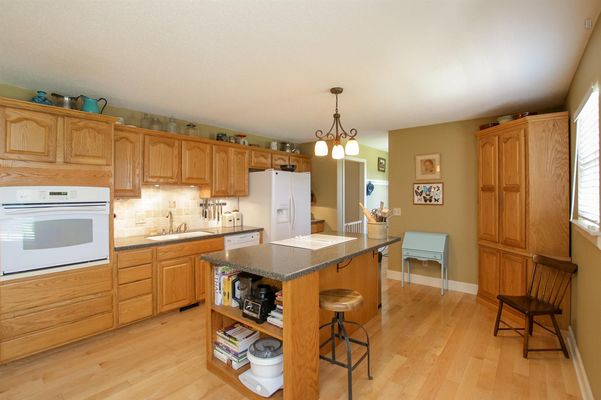 337 Tomlinson Road Lebanon, TN 37087 - Photo 14 of 27 a kitchen with granite countertop a sink cabinets stainless steel appliances and dining table