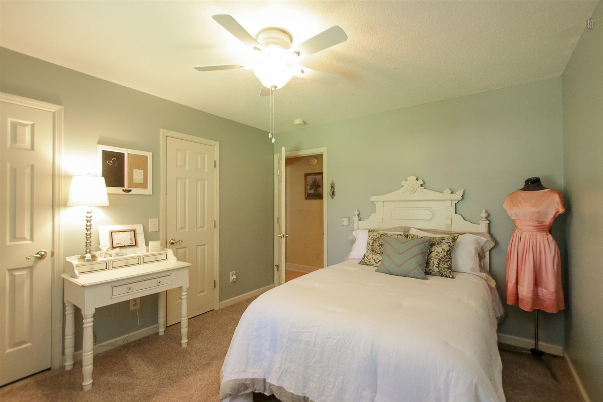 337 Tomlinson Road Lebanon, TN 37087 - Photo 17 of 27 a bedroom with a bed and a chandelier