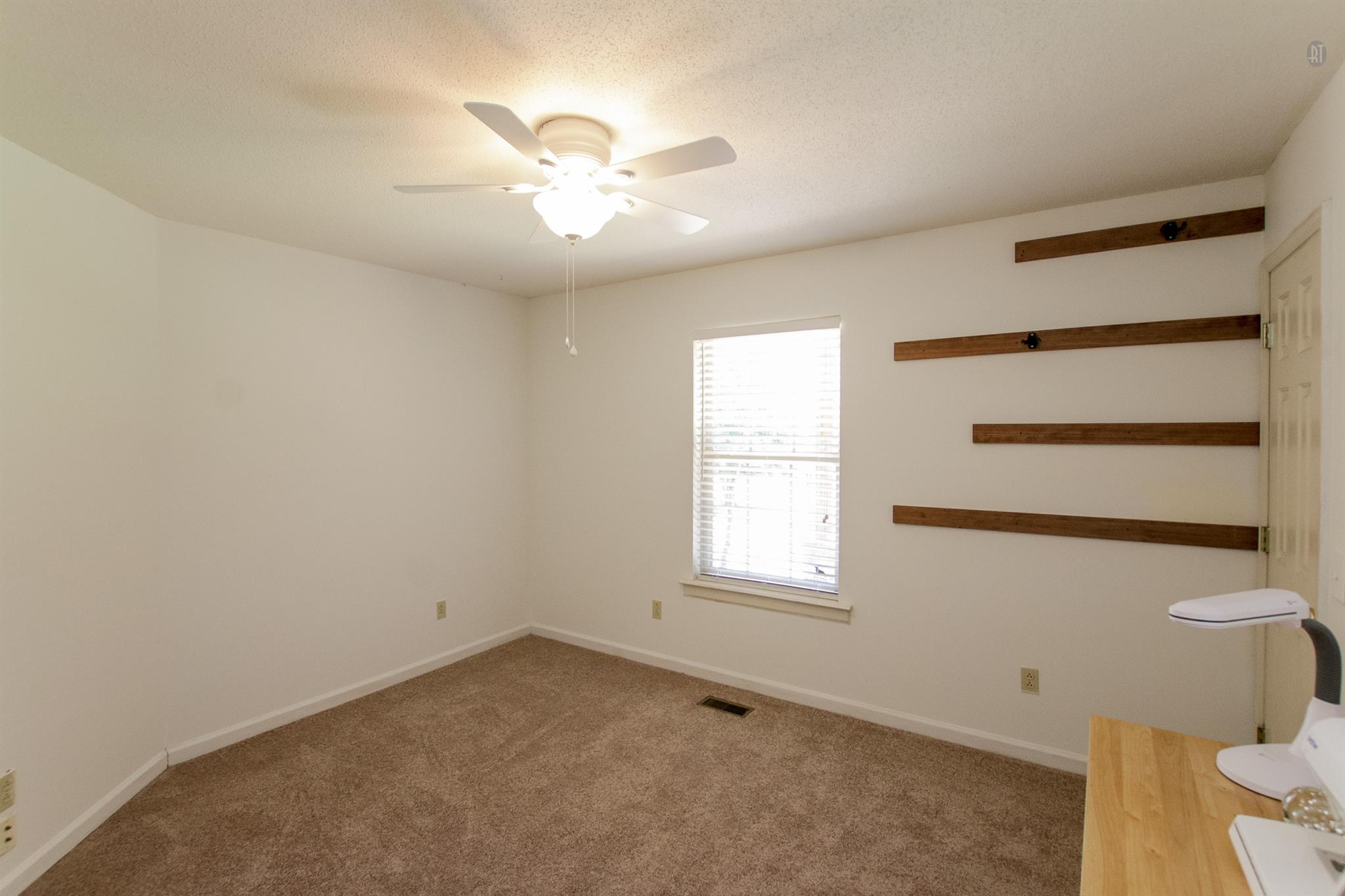 337 Tomlinson Road Lebanon, TN 37087 - Photo 18 of 27 an empty room with windows and fan
