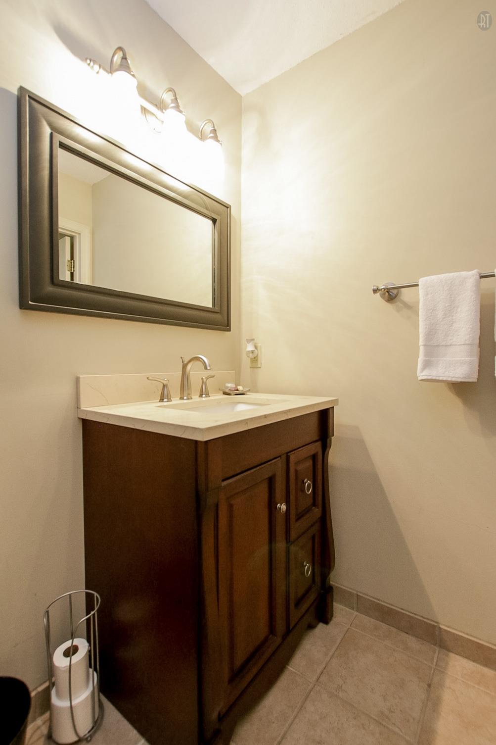 337 Tomlinson Road Lebanon, TN 37087 - Photo 19 of 27 a bathroom with a sink vanity mirror and toilet