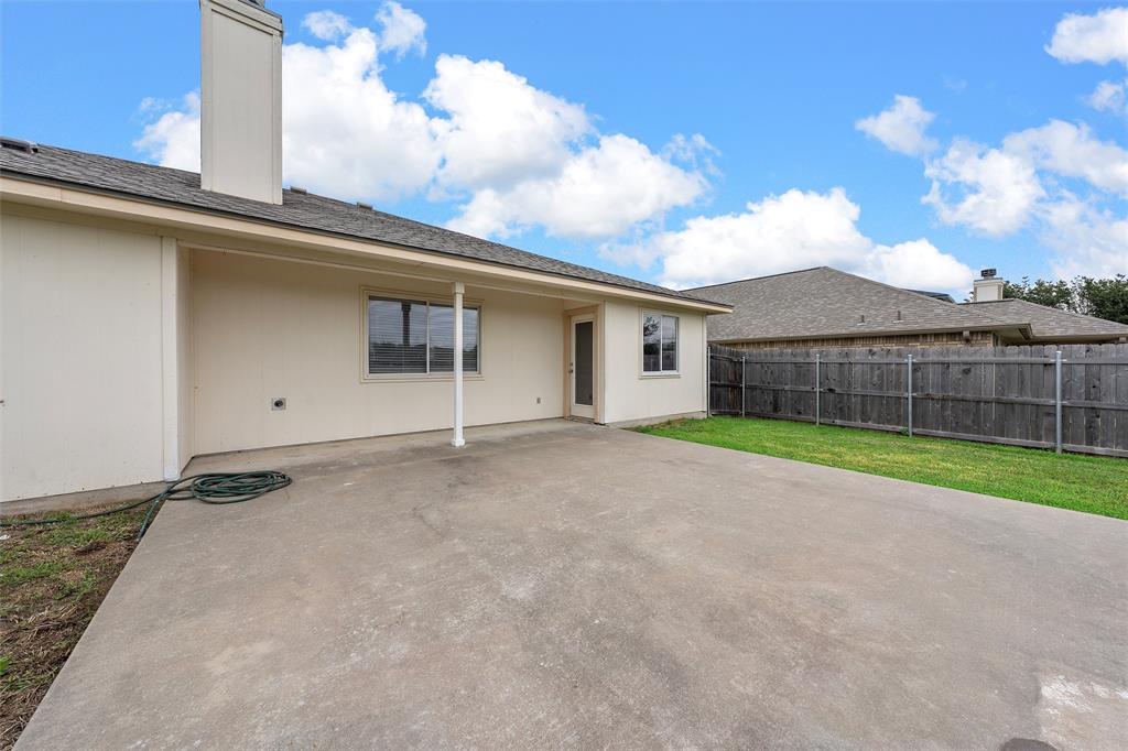 10120 Salem Way Waco, TX 76708 - Photo 17 of 19 Rear view of property featuring a chimney, a patio, and a shingled roof