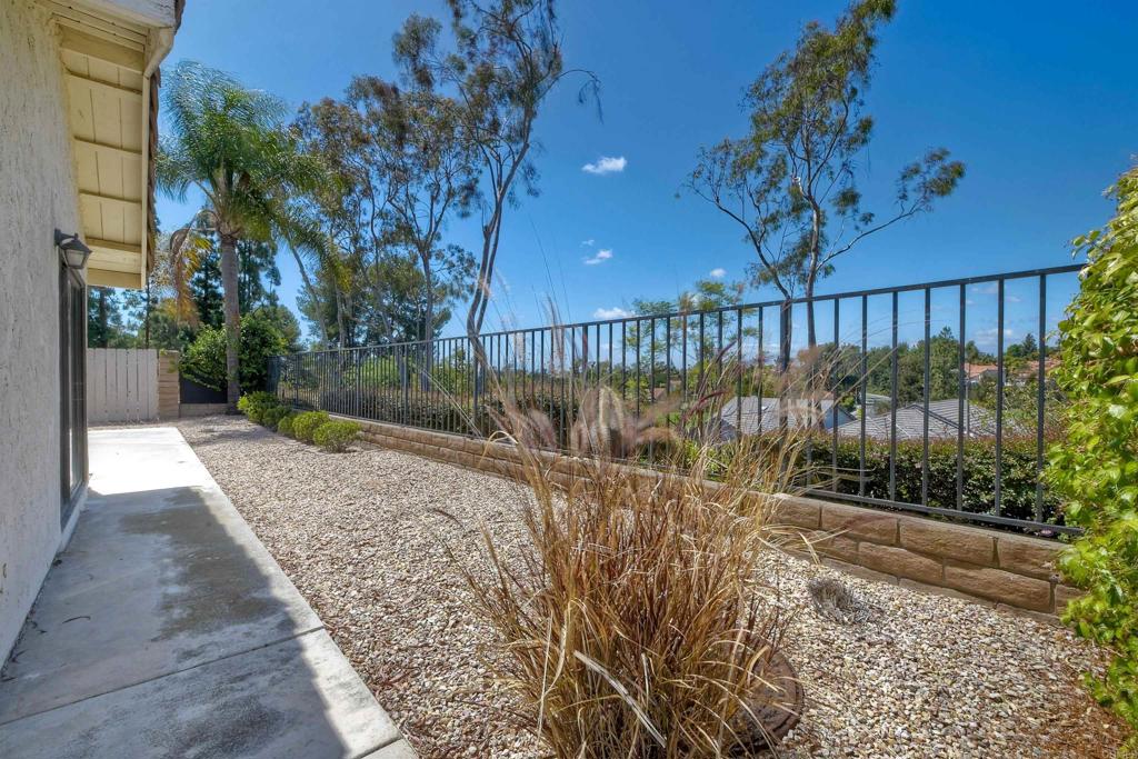 1394 Longfellow Road Vista, CA 92081 - Photo 33 of 50 a view of a pathway with a bench in patio