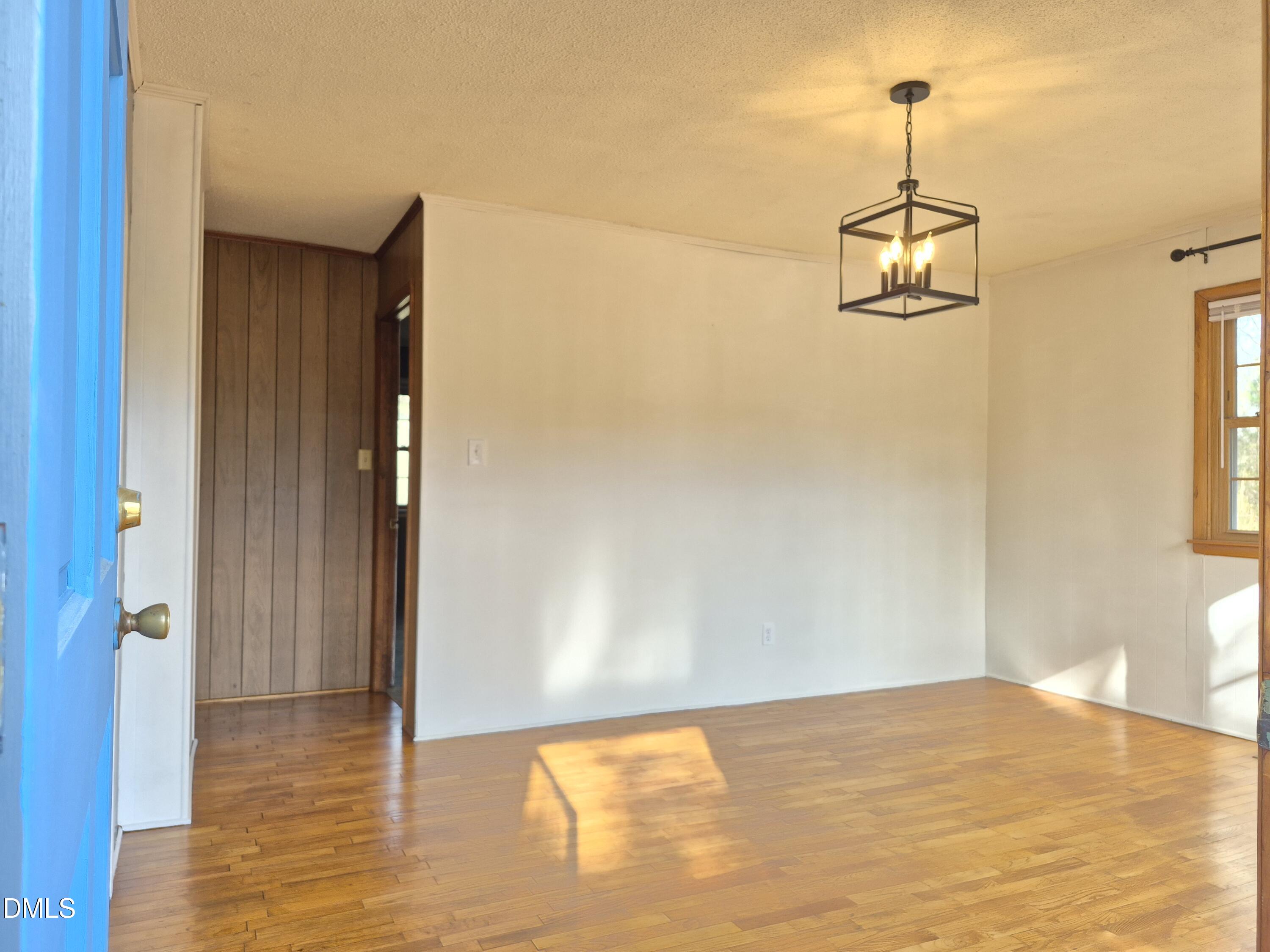 269 Beaver Dam Road Norlina, NC 27563 - Photo 15 of 33 a view of empty room with wooden floor and fan