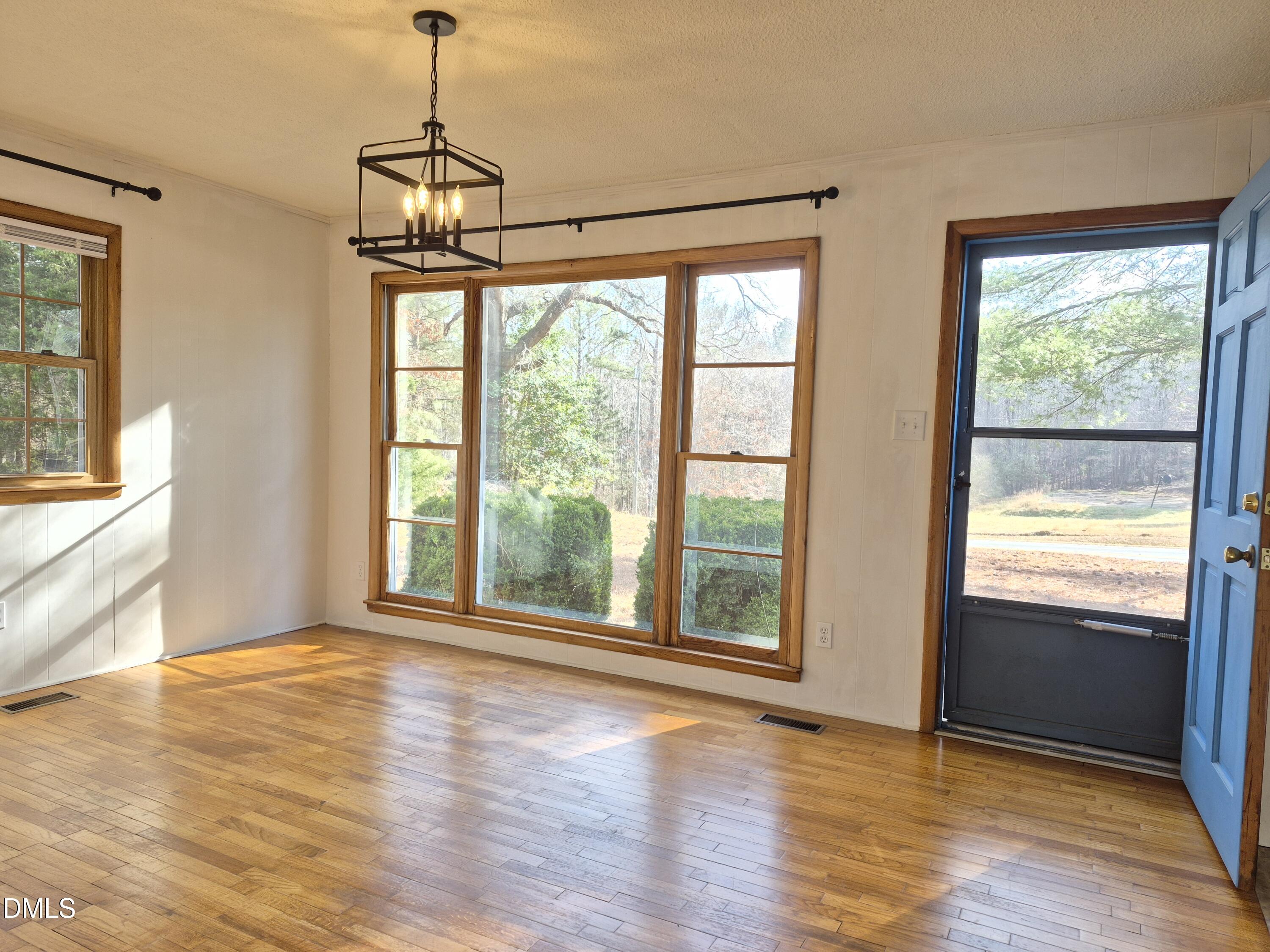 269 Beaver Dam Road Norlina, NC 27563 - Photo 16 of 33 a view of an empty room with wooden floor and a window