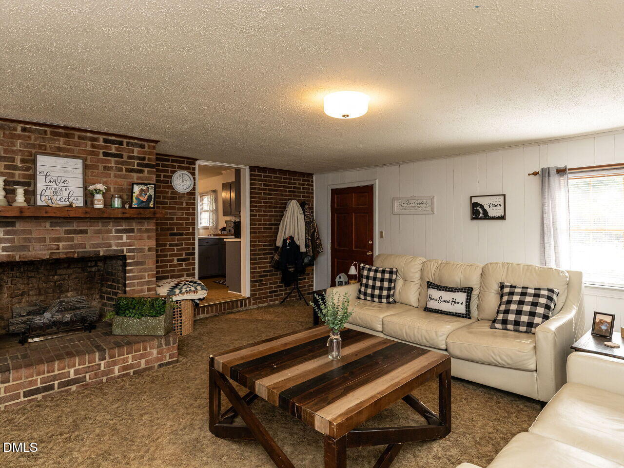 269 Beaver Dam Road Norlina, NC 27563 - Photo 16 of 38 a living room with furniture and a fireplace