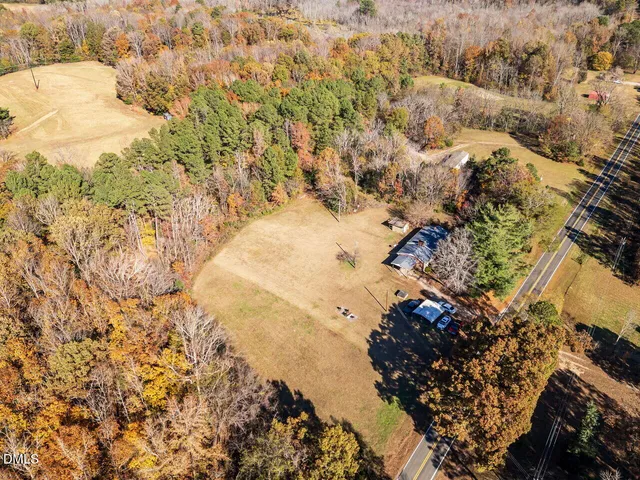 a view of a lake in middle of the forest