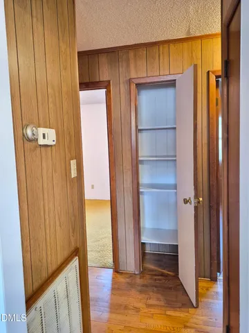 a view of water heater room with glass door